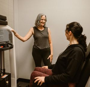A person smiling peacefully after a workout session.